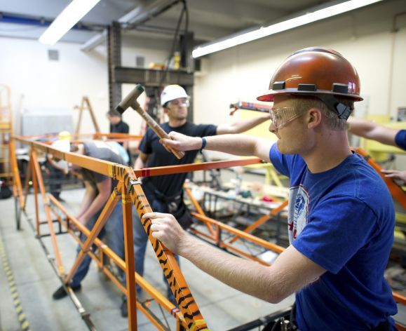 students working on bridge construction